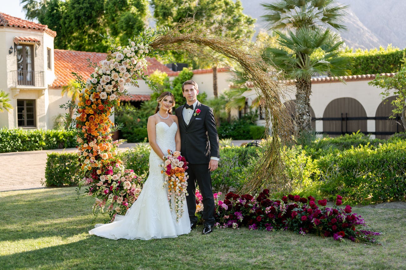BEAUTIFUL FLORAL ARCH AS YOUR BACKDROP. [PHOTO CREDIT: LOUIS WILLARD PHOTO & FLORIST: VASCO BELLA & RONN BURNS]