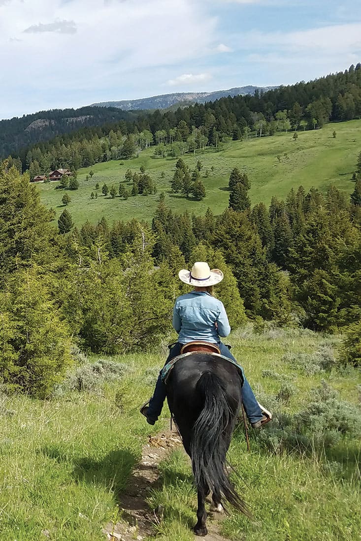 Woman riding a horse in Big Sky, Montana
