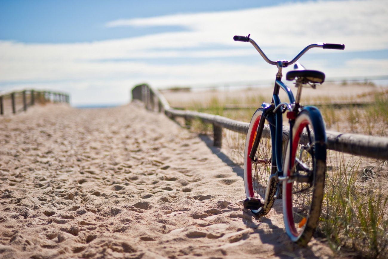 185834587 Sunny day at the beach with a bike