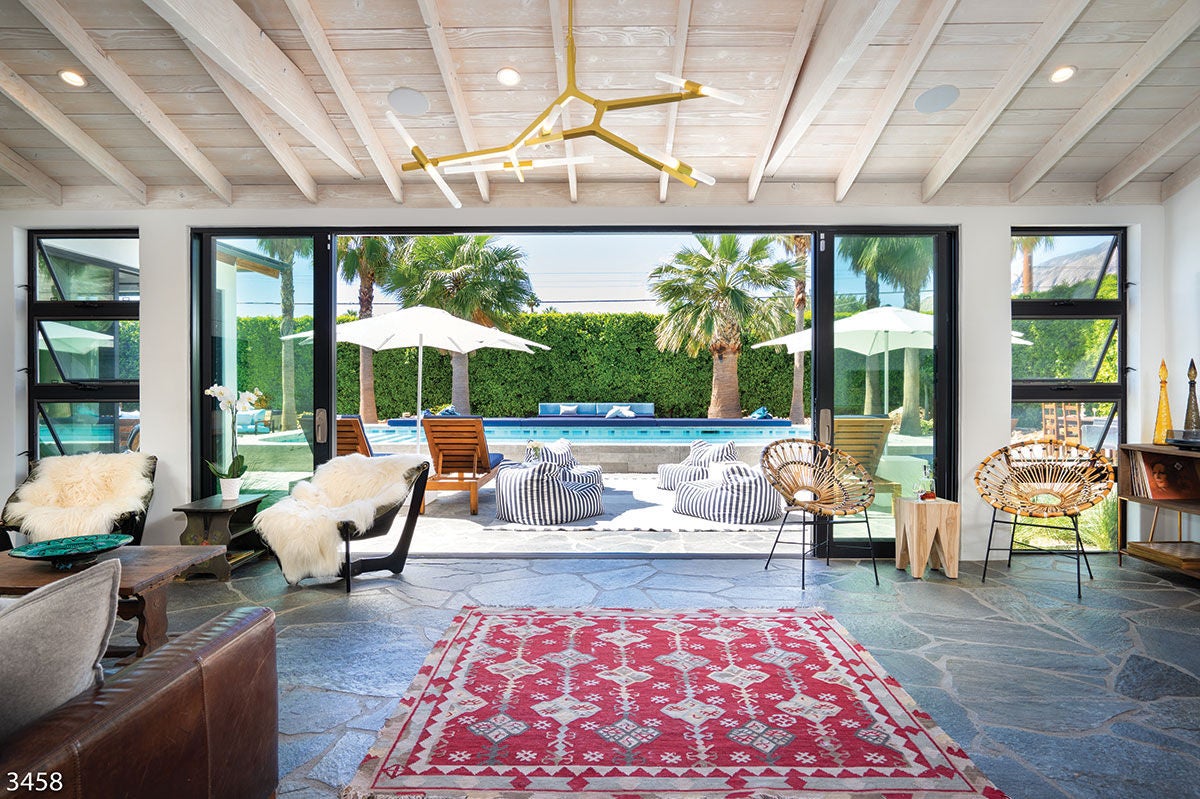 The living area looking out to the pool at Hinshaw Hideaway (3458) in Palm Springs, California