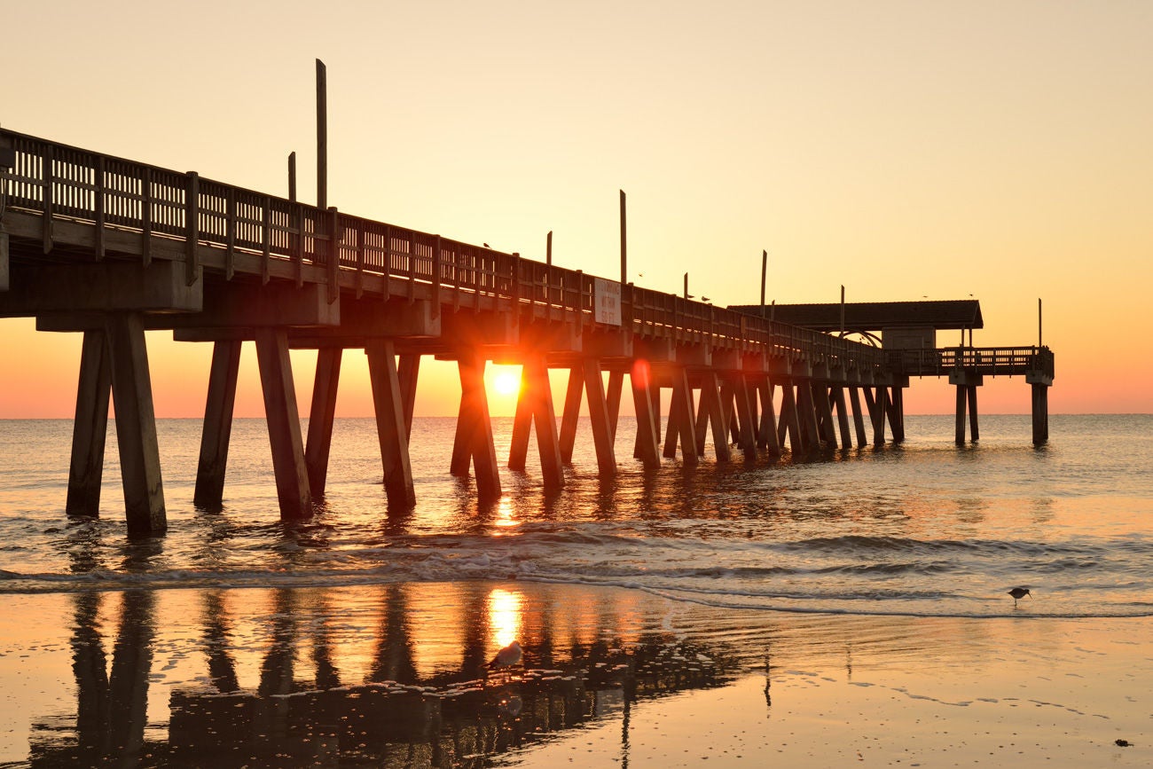 Pier of Tybee Island Beach at sunrise, Georgia, USA