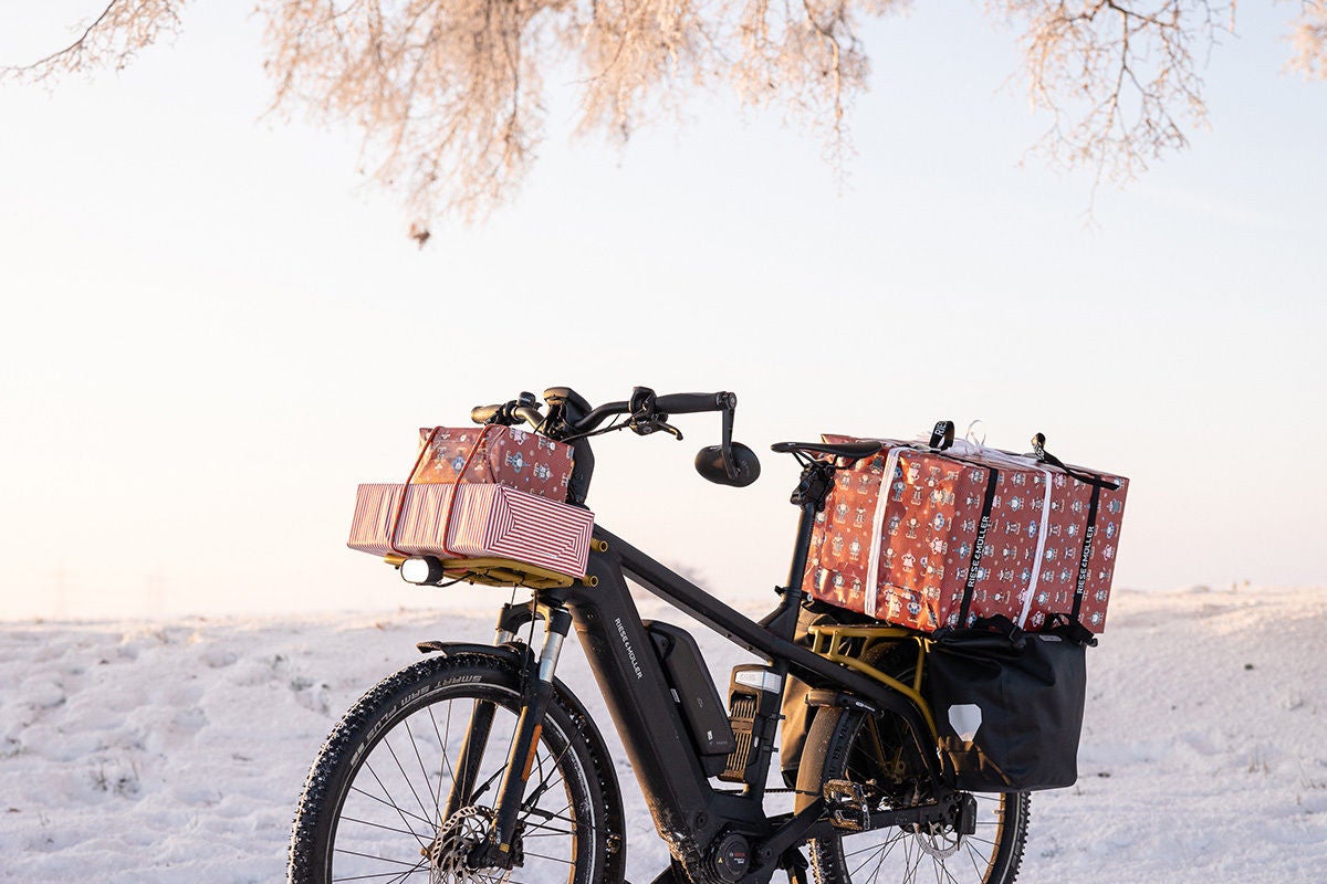 Bicycle on the beach with presents strapped to it