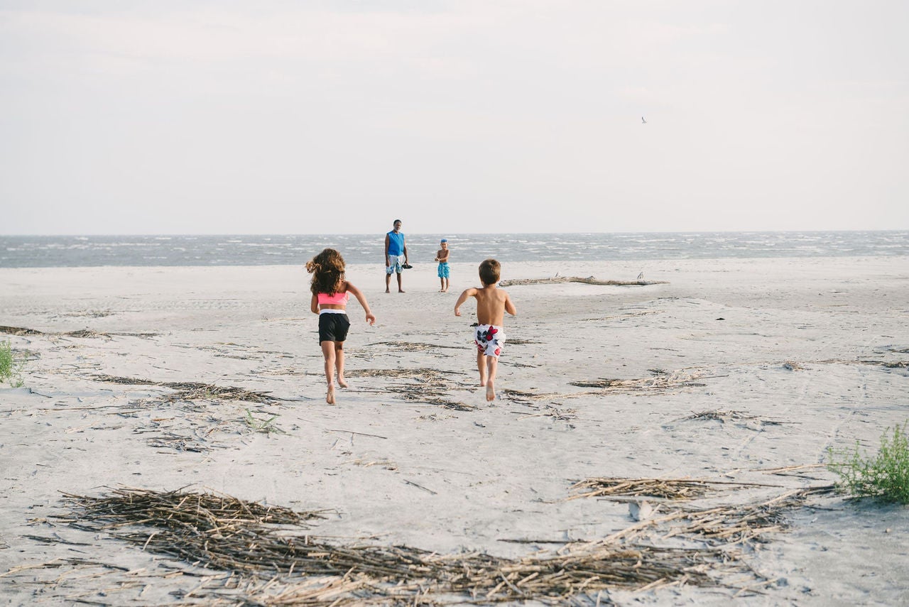 Family on beach in Sea Islands, South Carolina