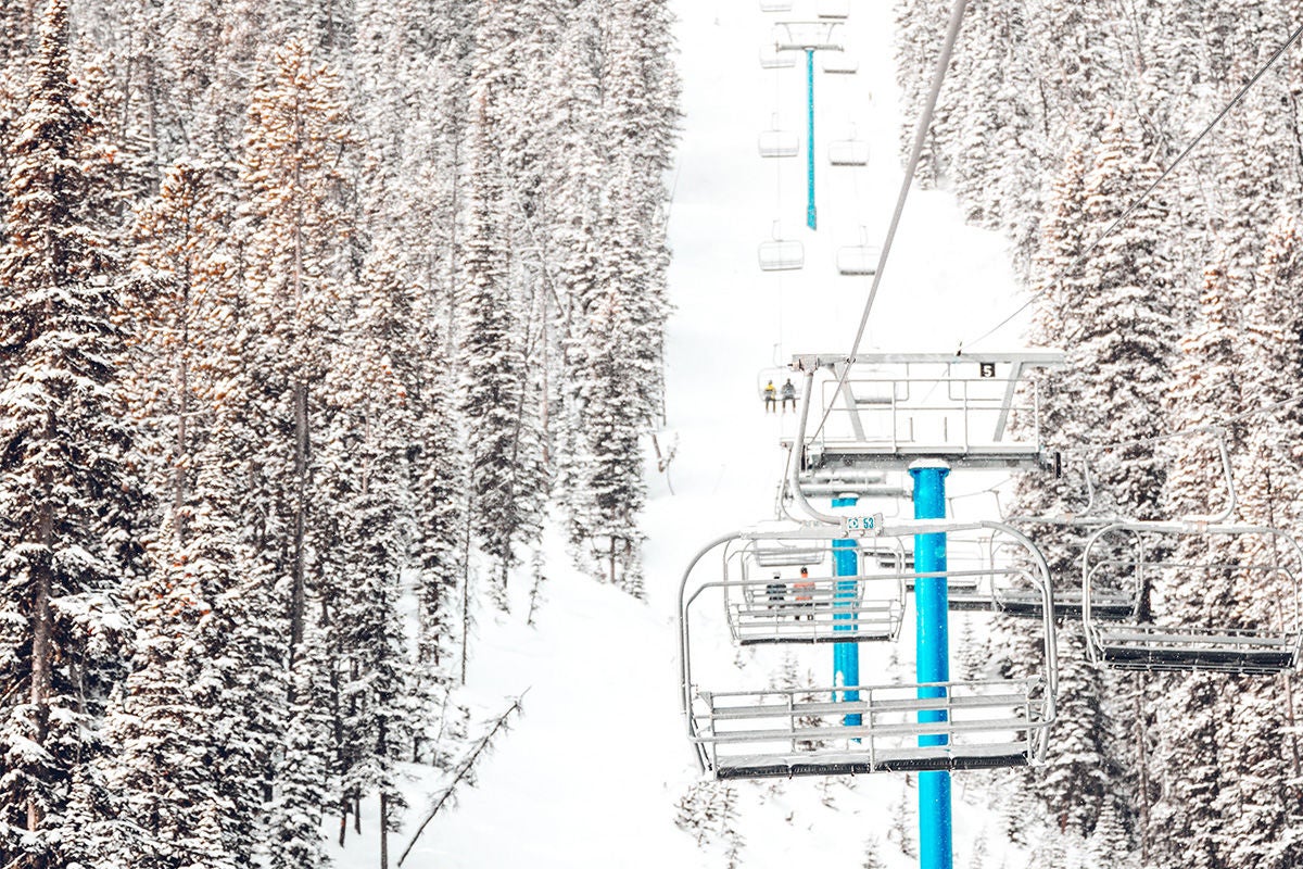 Ski lift on snowy mountain.