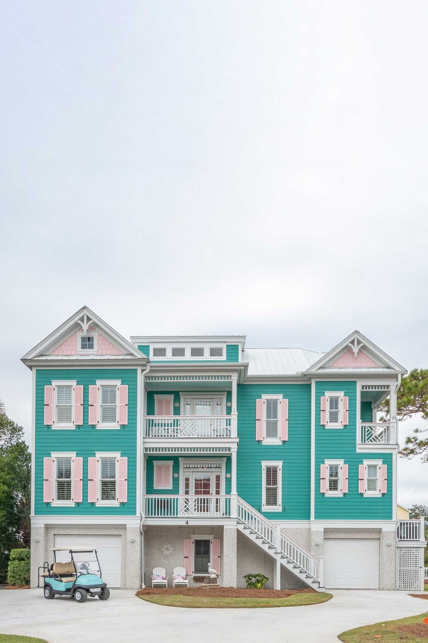 teal and pink rental home in sea island with a golf cart