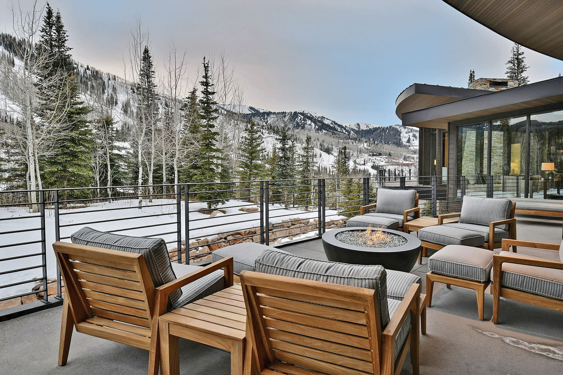 Mountain outdoor deck with fireplace during ski season